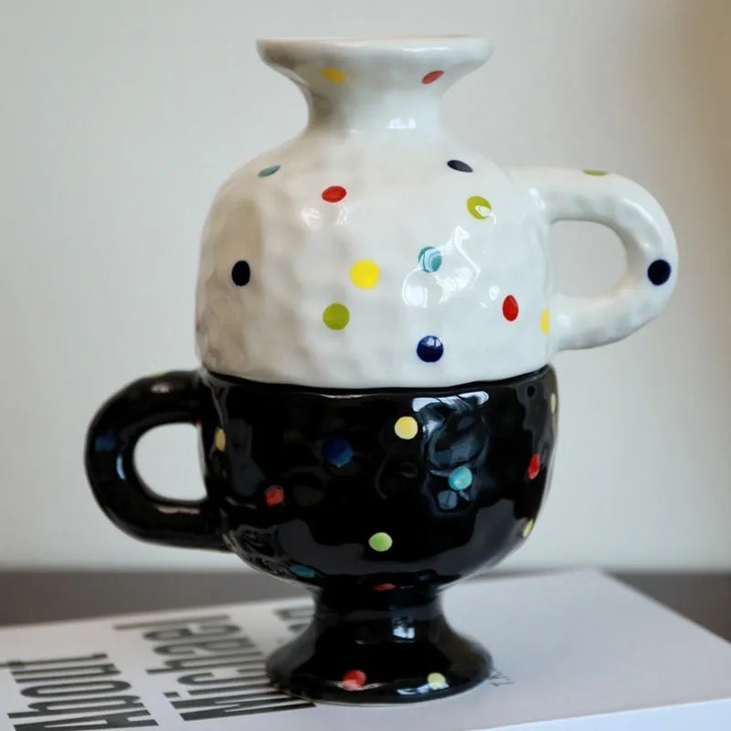 Hand-pinched irregular shaped ceramic mug in a solid colour, showing its unique form.