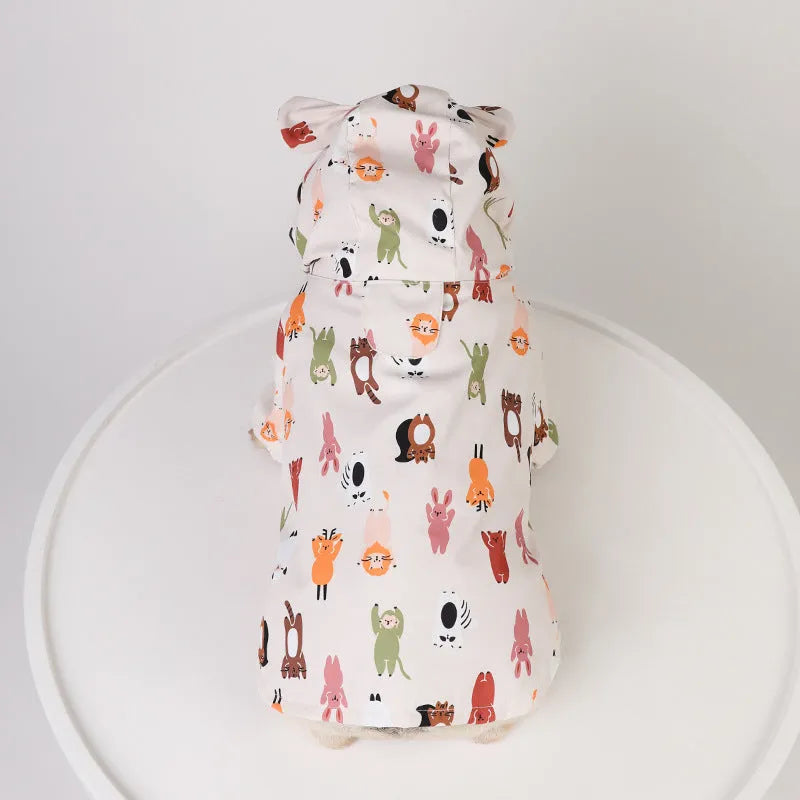 Beige dog raincoat with cartoon design in waterproof PU material