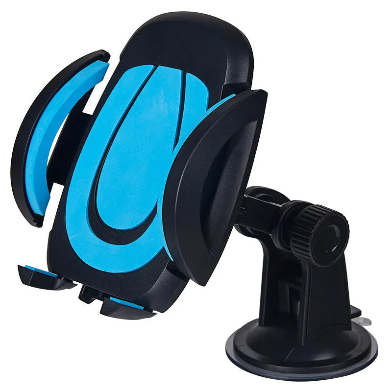 Red U-shaped car phone holder with suction cup base and adjustable clamp arms on a vehicle dashboard