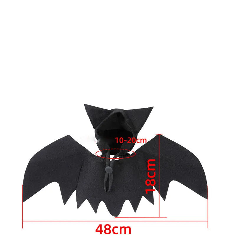 Black felt bat wing costume for cats and dogs with Velcro strap, size L shown on a pet