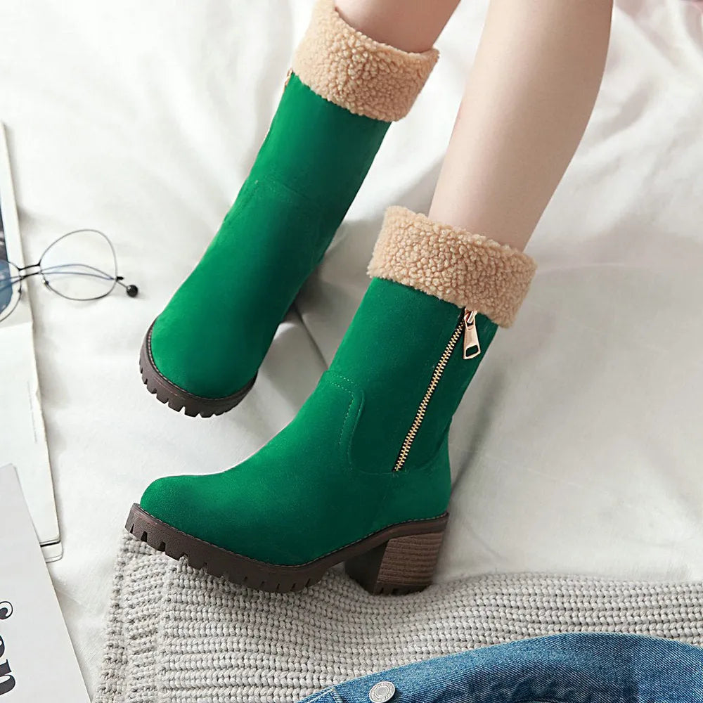 Snow boots in black, grey, green, and orange colours with a plush lining and rubber insole.