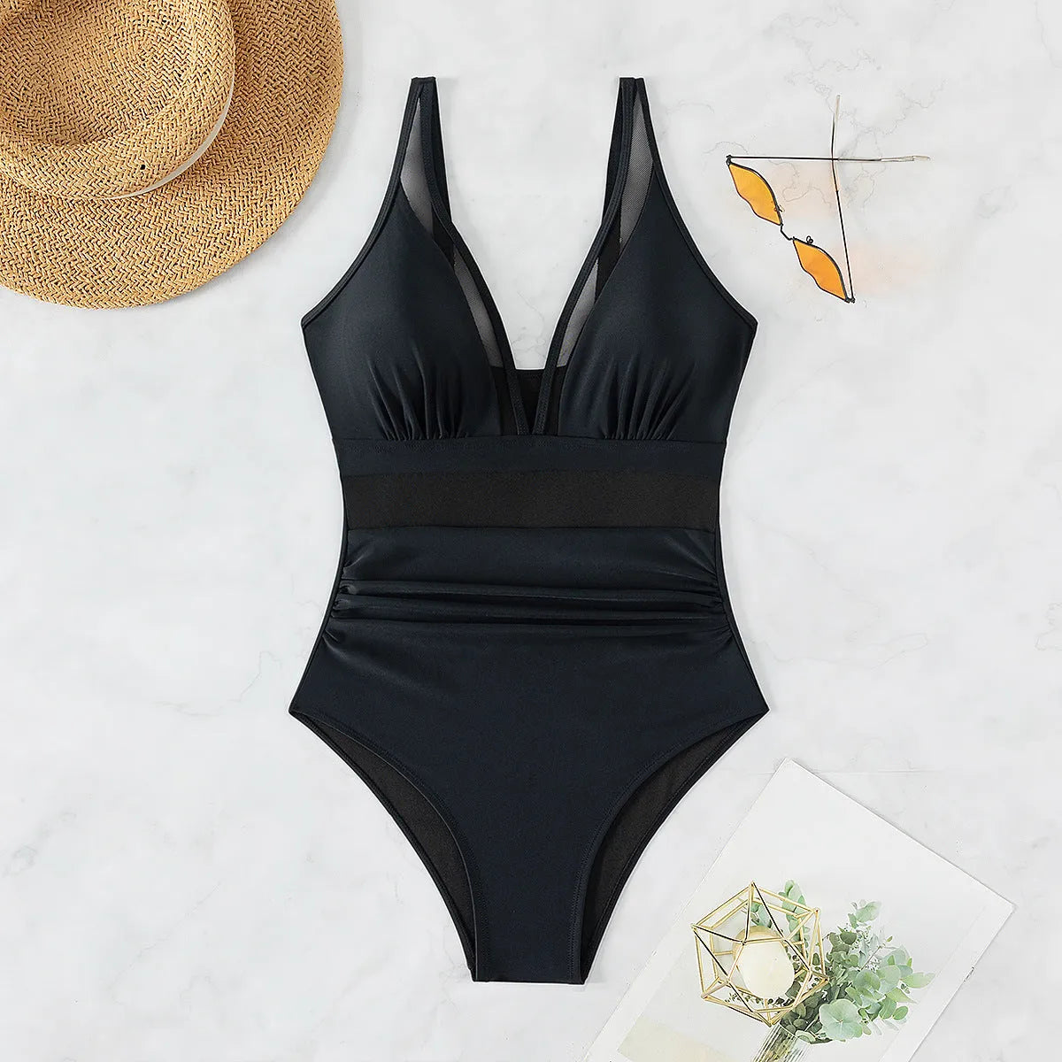 Black women's halter one-piece swimsuit with mesh detailing and sleeveless design