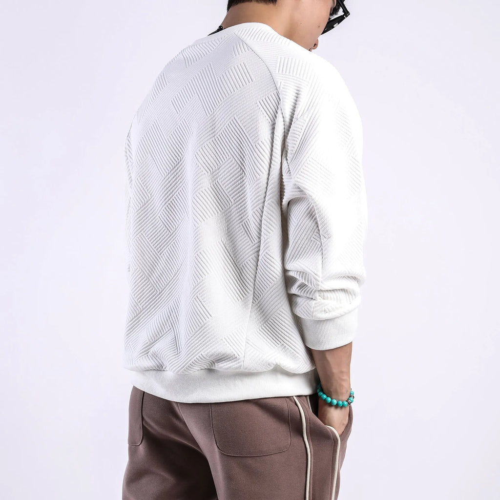 Man wearing a loose fit Army Green long sleeve twill jacquard pullover sweater.