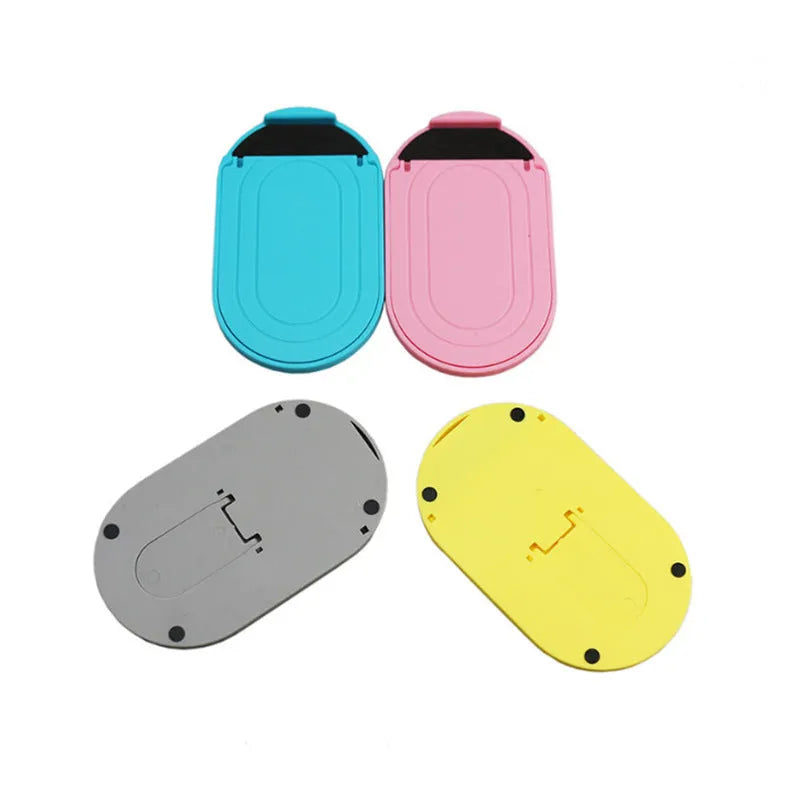 Plastic mobile phone stand in six colour options showing bracket design for desk use