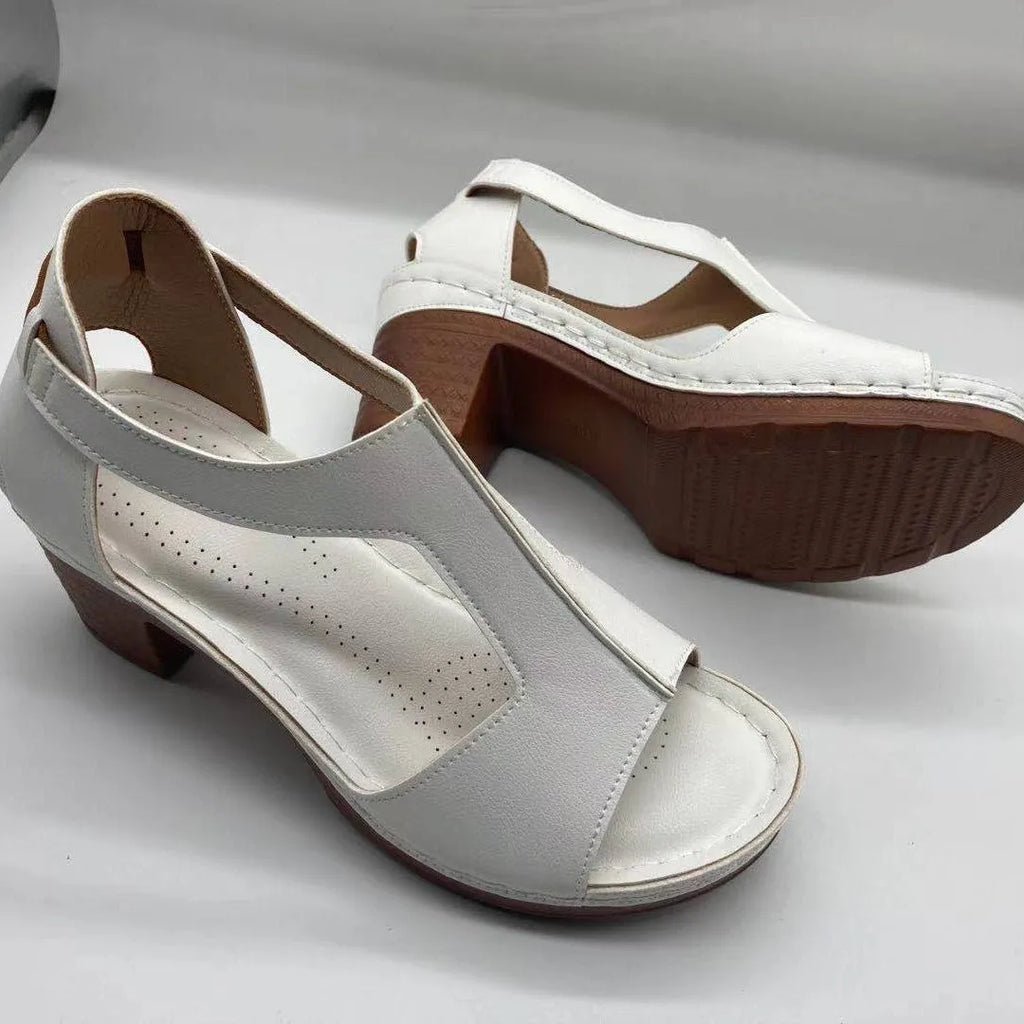 Peep toe wedge sandals with Roman style buckle and fish mouth open toe design in creamy-white colour
