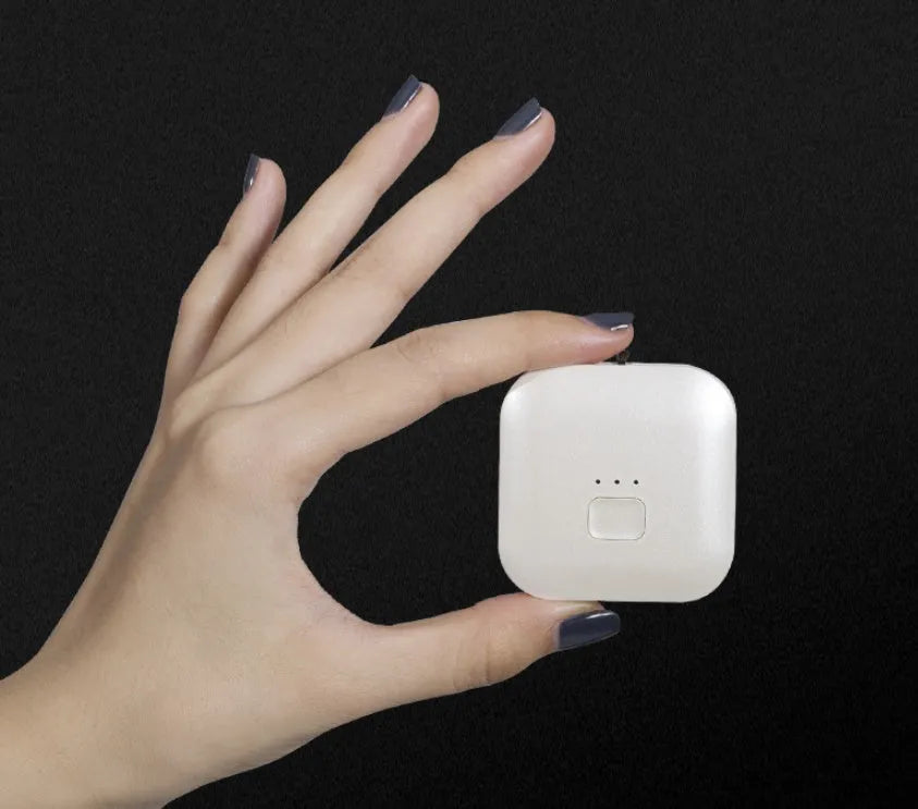 USB rechargeable mini air purifier necklace in blue, showing compact design worn around neck.