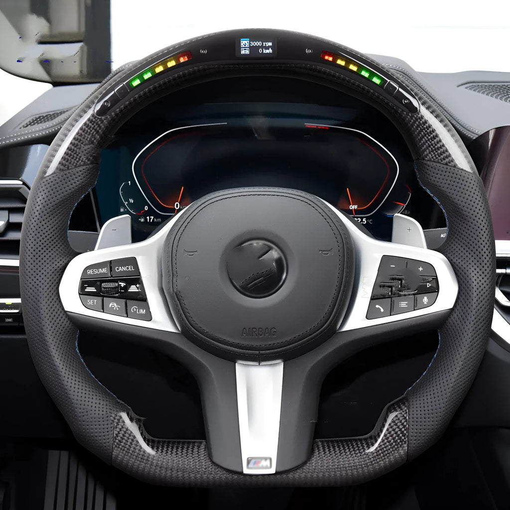 Black carbon fibre BMW sports steering wheel with LED display and multifunctional buttons.