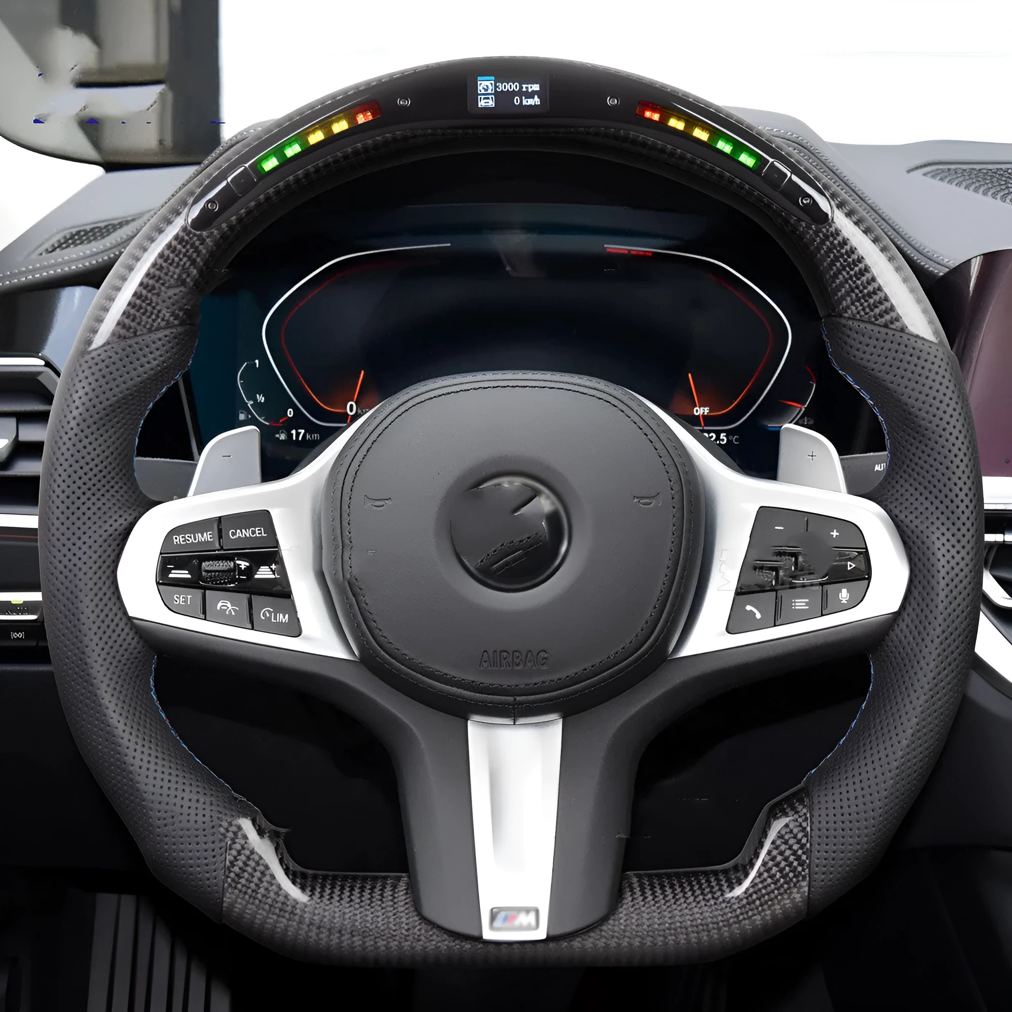 Black carbon fibre BMW sports steering wheel with LED display and multifunctional buttons.
