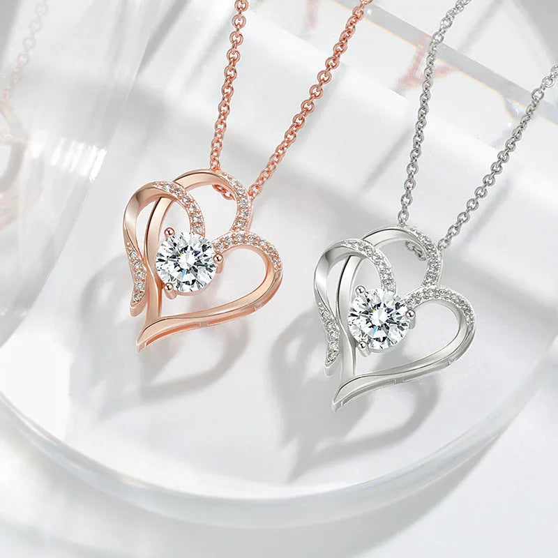 Close-up of a women's heart-shaped pendant necklace in 925 silver with a diamond-treated finish