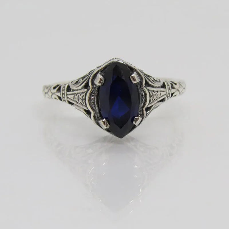 Women's silver alloy ring with geometric hollow pattern and zircon detailing