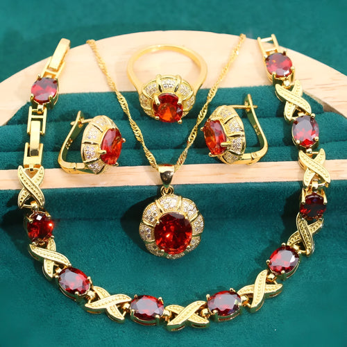 Complete 18k gold plated jewellery set showing necklace, earrings, ring and bracelet with multi-coloured cubic zirconia stones.