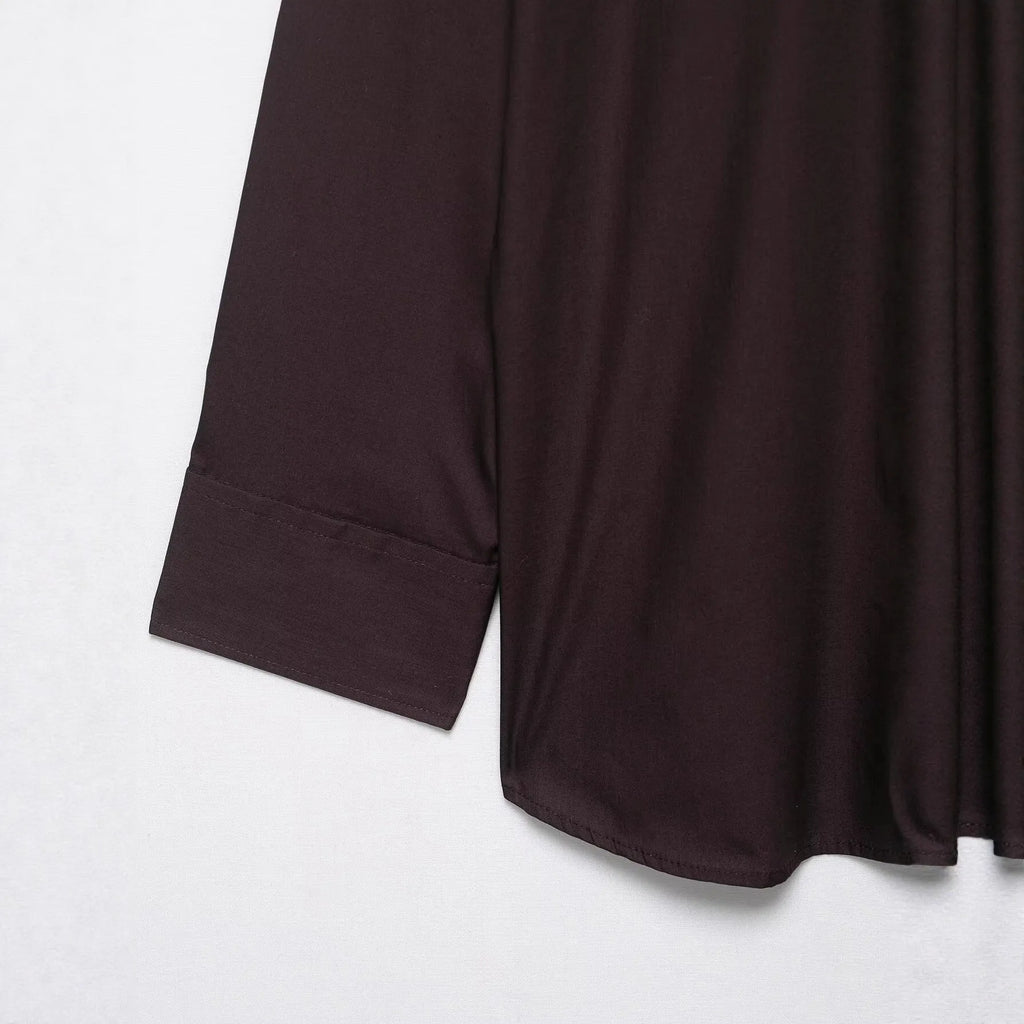 Brown women's loose-fit poplin shirt with long sleeves and a built-in bow tie detail.