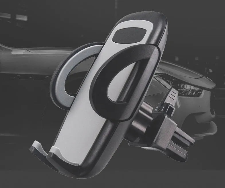 Universal black plastic car air vent mobile phone holder mounted on a car dashboard.
