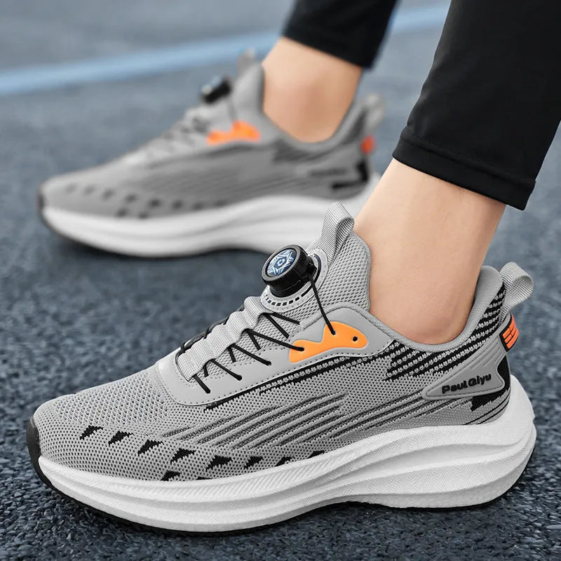 Men's white and green Fly-kit mesh running shoes with rotating buckle and TPU popcorn sole on a flat heel.