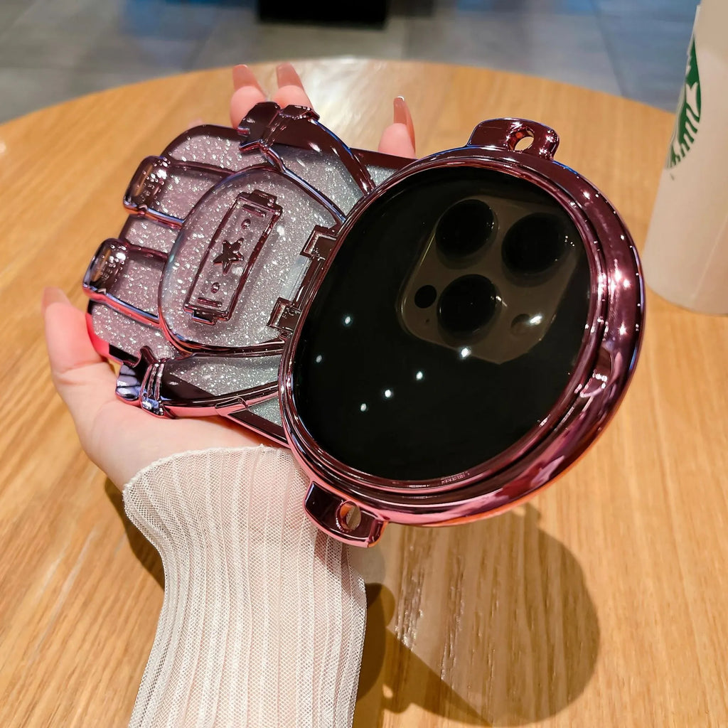 Electroplated TPU astronaut phone case for iPhone 14 Pro Max in pink with mirror finish, bracket, and lanyard.