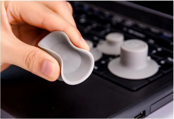 Grey plastic laptop cooling pad set showing large and small sizes on flat surface