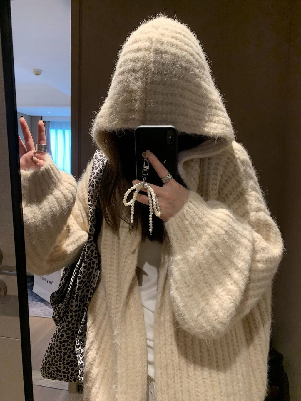 Retro style women's hooded cardigan in dark grey, shown loose-fit as a casual outer layer.