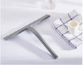 Silicone body wiper 22.8cm with metal-reinforced handle and hanging hook, black colour on glass surface