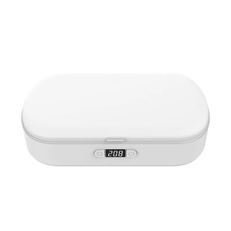 White portable UV sterilisation box with wireless charging for phones and jewellery disinfection