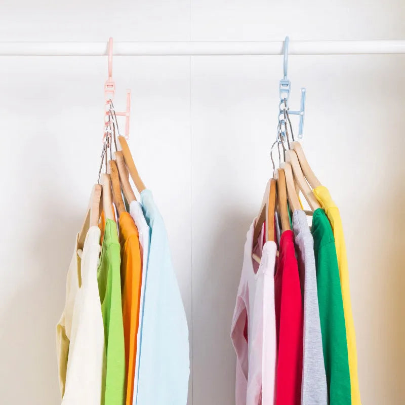 Blue revolving plastic wardrobe hanger with five holes and a top handle on a white background.