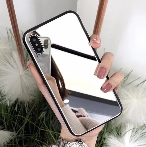 Black iPhone mirror case showing reflective surface on back, compatible with multiple iPhone models