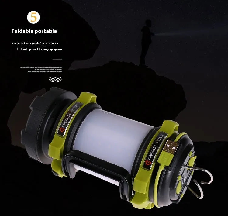 Green KS-5992AC portable LED searchlight with 5W headlight and 3W side light on outdoor background