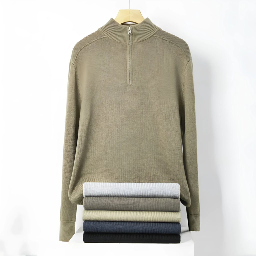 Man wearing a slim fit grey wool pullover sweater with long sleeves.