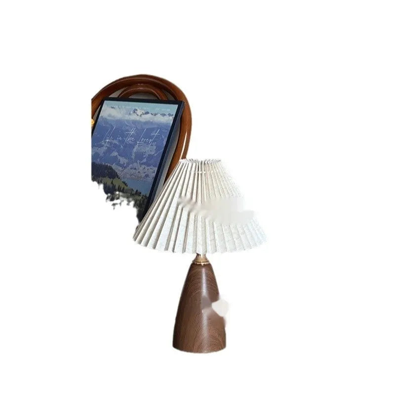 Nordic retro ceramic table lamp with pleated fabric shade and remote control on a bedside table