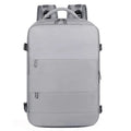 Large grey travel backpack with multiple pockets and an air pillow belt, shown open to reveal internal organisation.