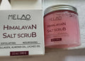 250g tub of Himalayan salt body scrub with white cream texture