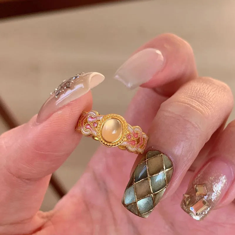 Pink crystal enamel geometric open mouth ring for women on gold-plated copper band.
