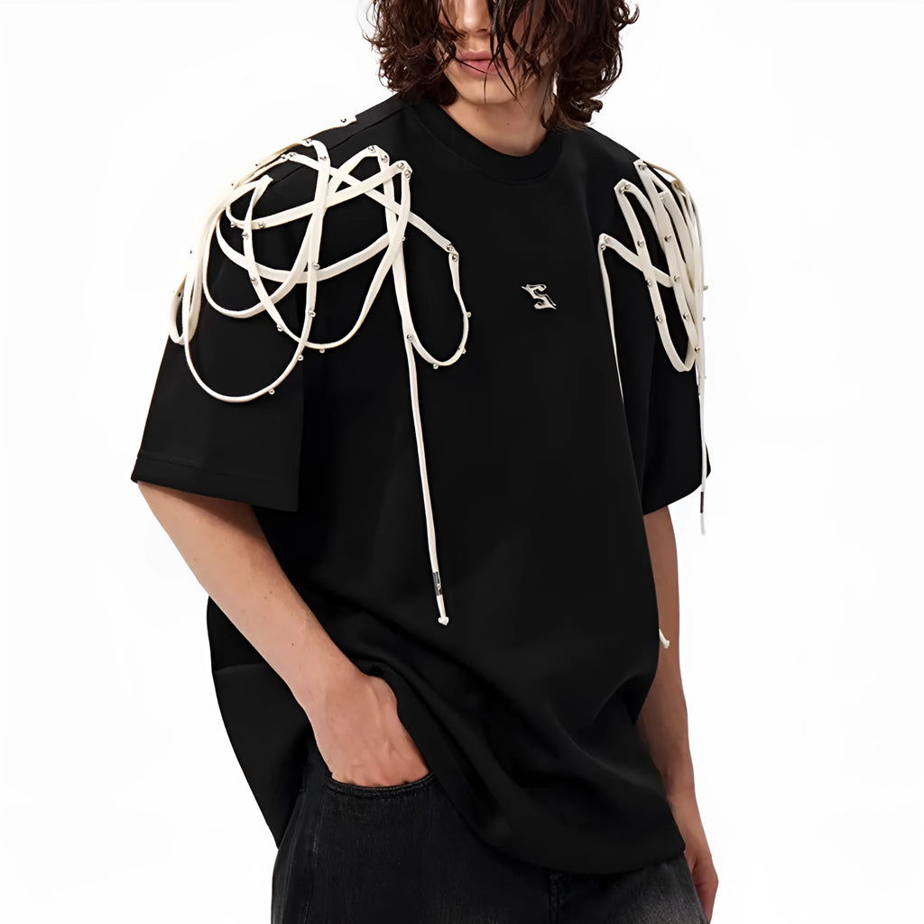 Black loose fit short sleeve t-shirt with rivet ribbon detail on padded shoulders.