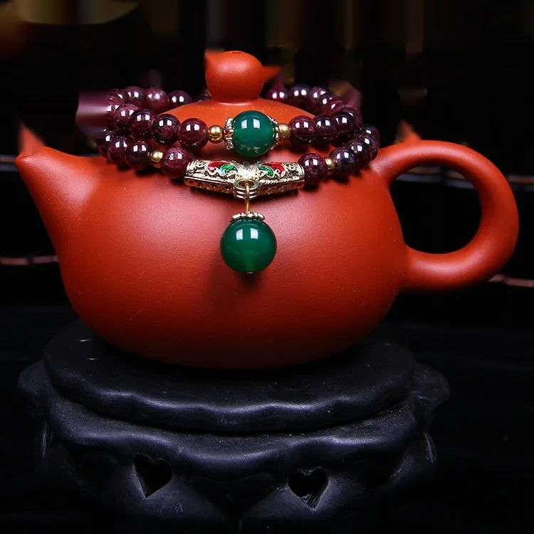 Natural garnet bracelet with 7mm beads, double ring design and Golden Toad charm jewellery