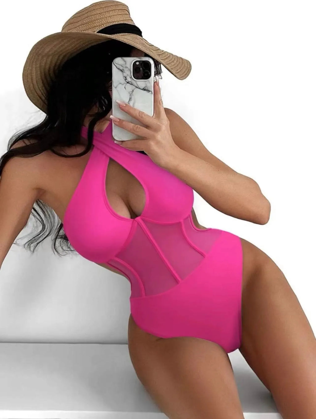 A woman's one-piece bikini swimsuit on a hanger, shown in black, rose red, and green colour options.