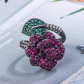 Women's geometric flower ring in black gold with simulated red corundum stone on gold-plated copper band