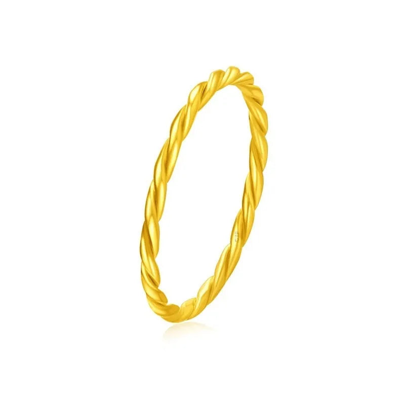 Brass gold plated women's ring showing twist, matte and glossy simple bracelet styles