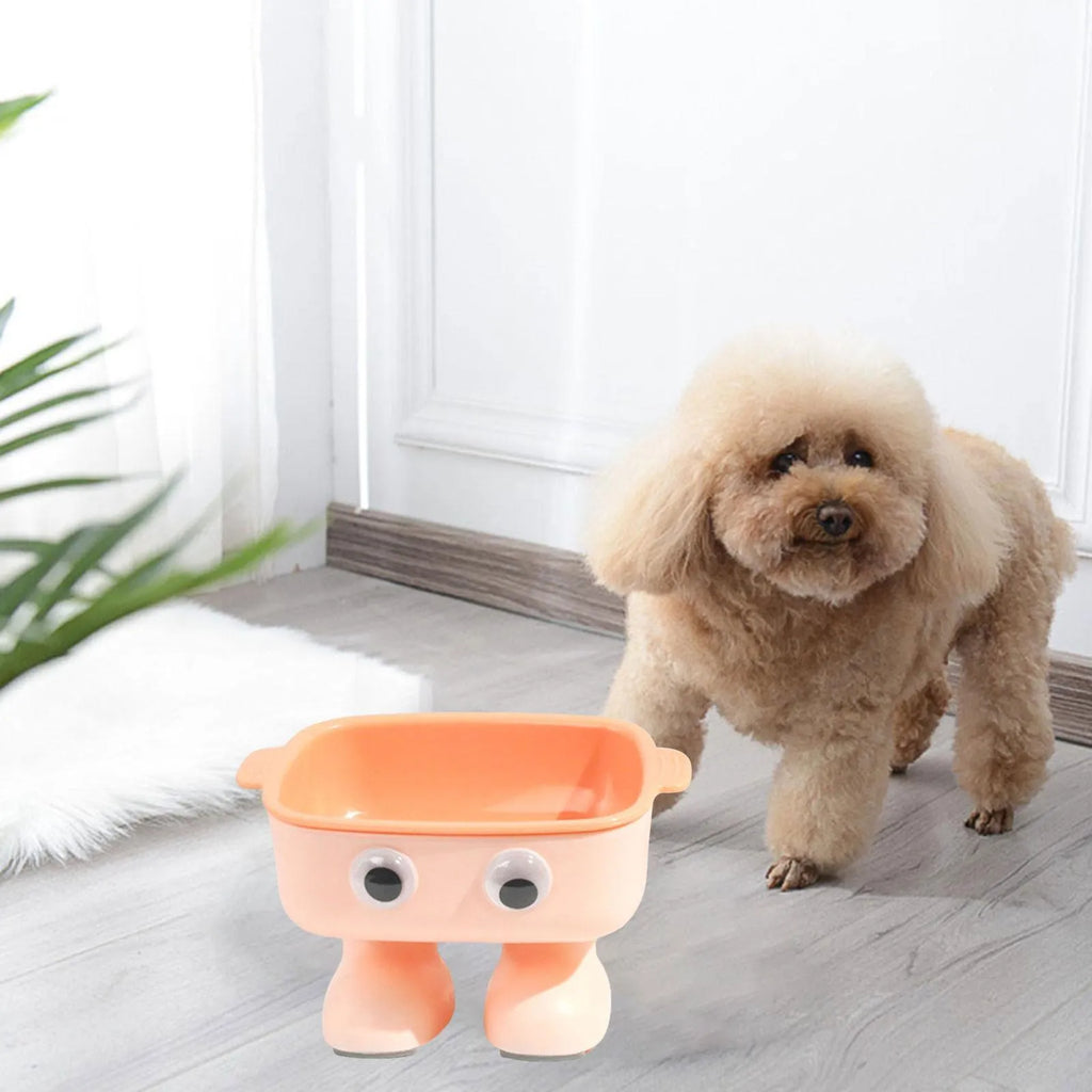 Green robot-shaped elevated cat bowl with 15-degree tilt and detachable inner dish