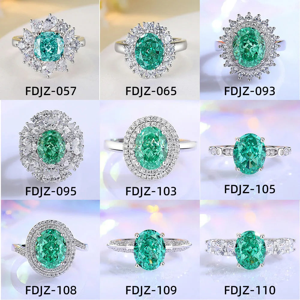 Women's sterling silver ring with a central emerald stone and diamond accent on a geometric band.