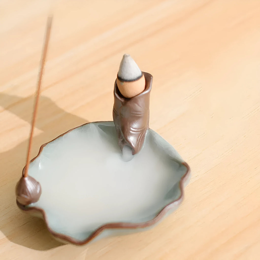 Square purple clay ceramic incense burner with lotus motifs and crystal glaze