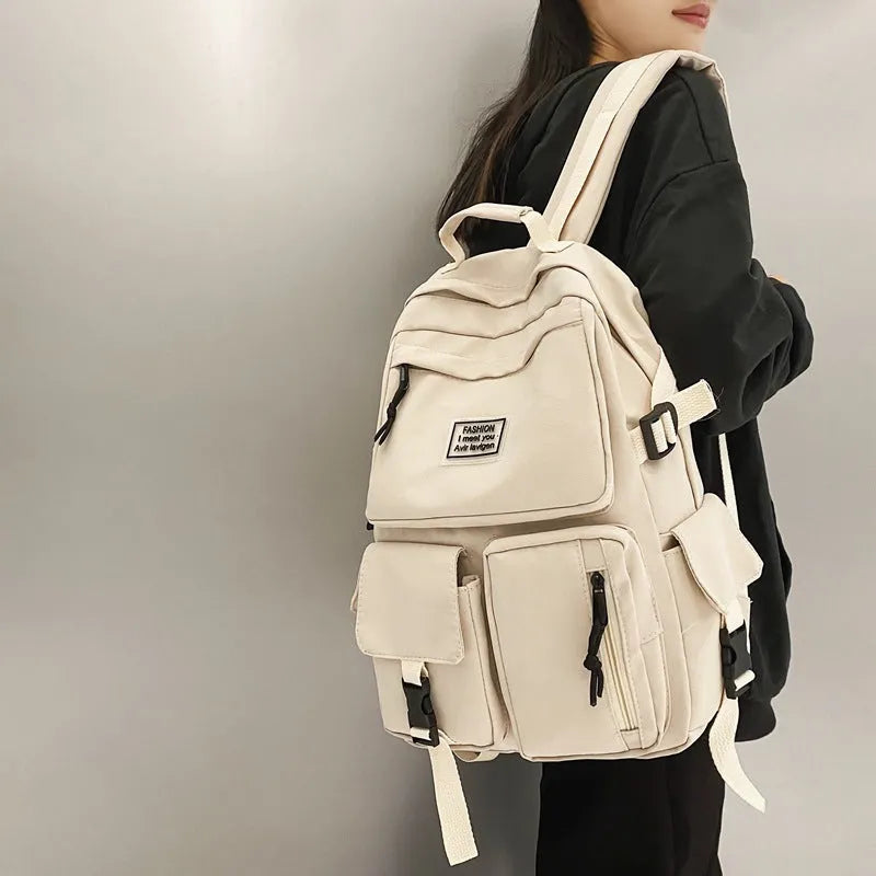 Soft nylon student backpack in black with laptop compartment and three-dimensional pocket