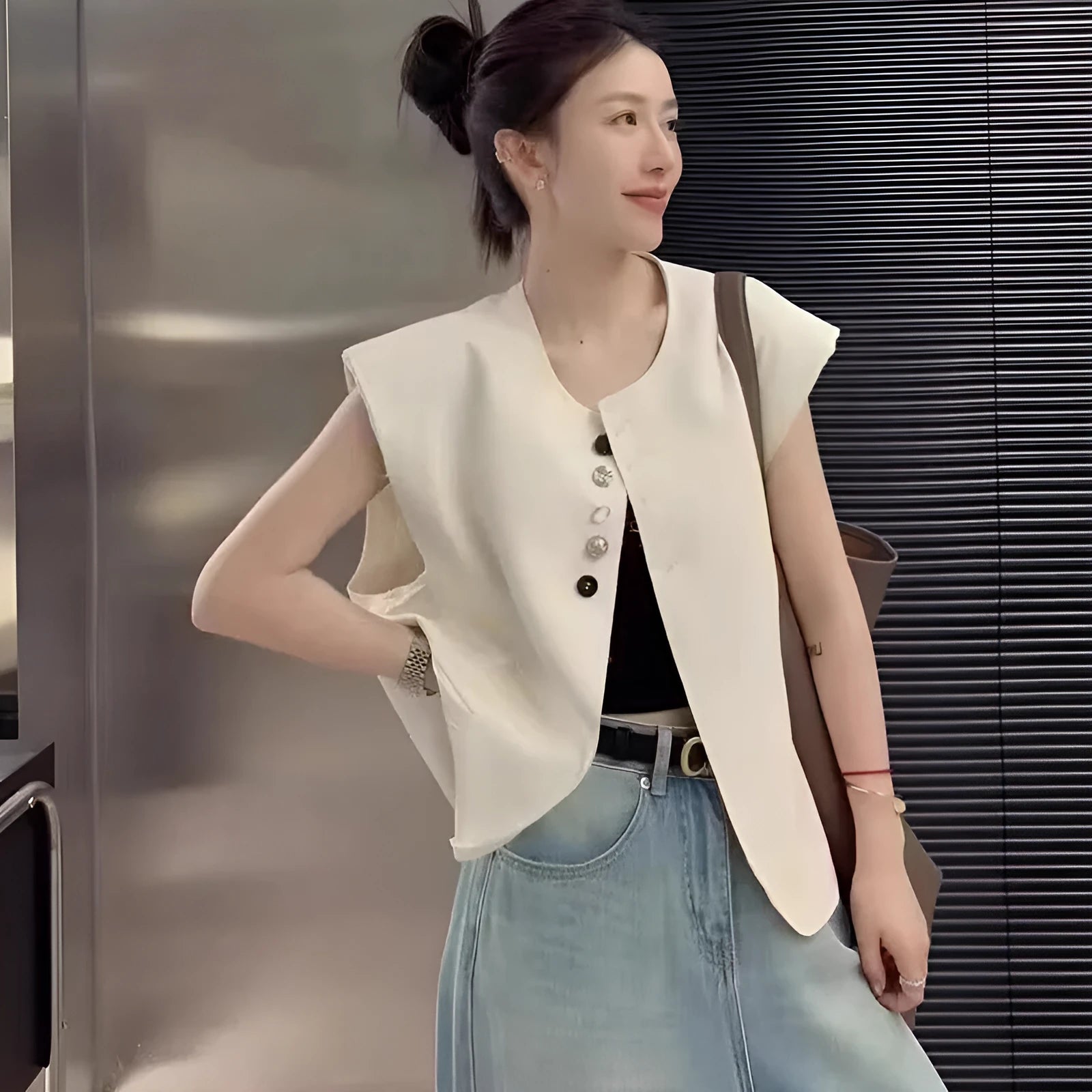 Women's milky white loose-fit polyester vest with pockets, shown with a short 40cm length.