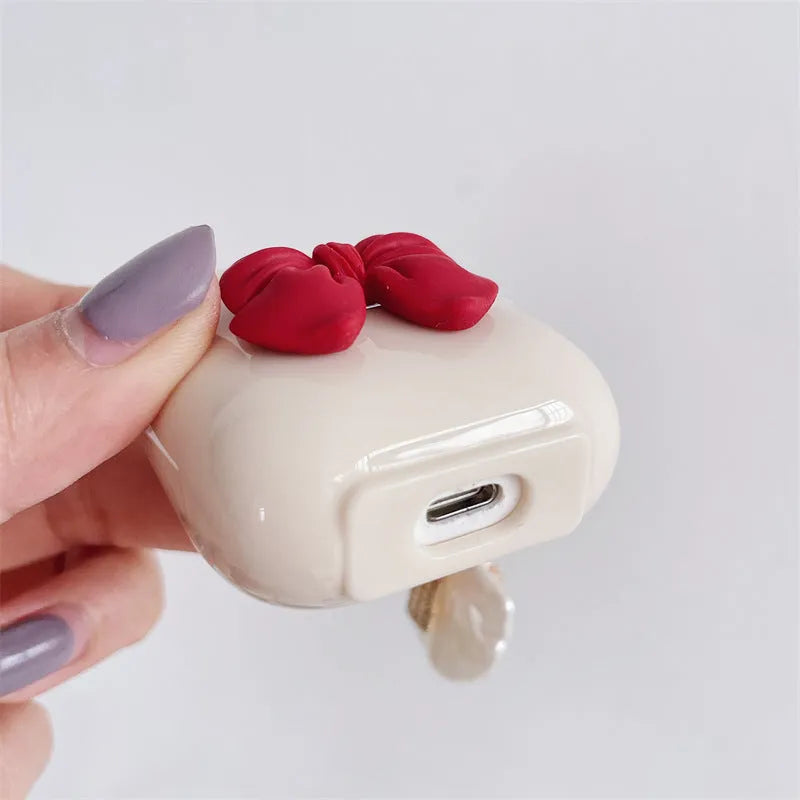 Beige red bow shell TPU earphone case for AirPods with clamshell closure