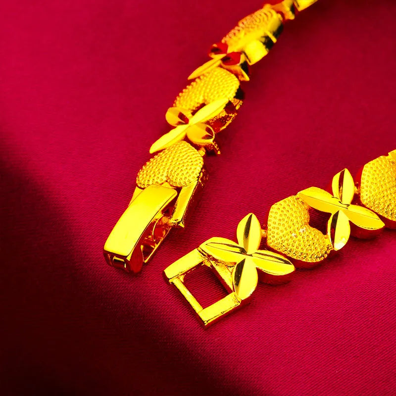 Sand gold four-leaf clover heart bracelet in brass with electroplated textured finish