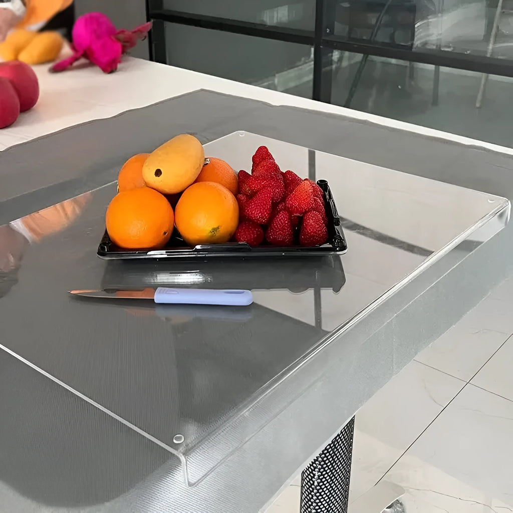 Transparent acrylic cutting board with anti-slip base on a kitchen counter