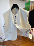 Loose-fitting waistcoat dress in beige or black with 40cm length and pocket detail