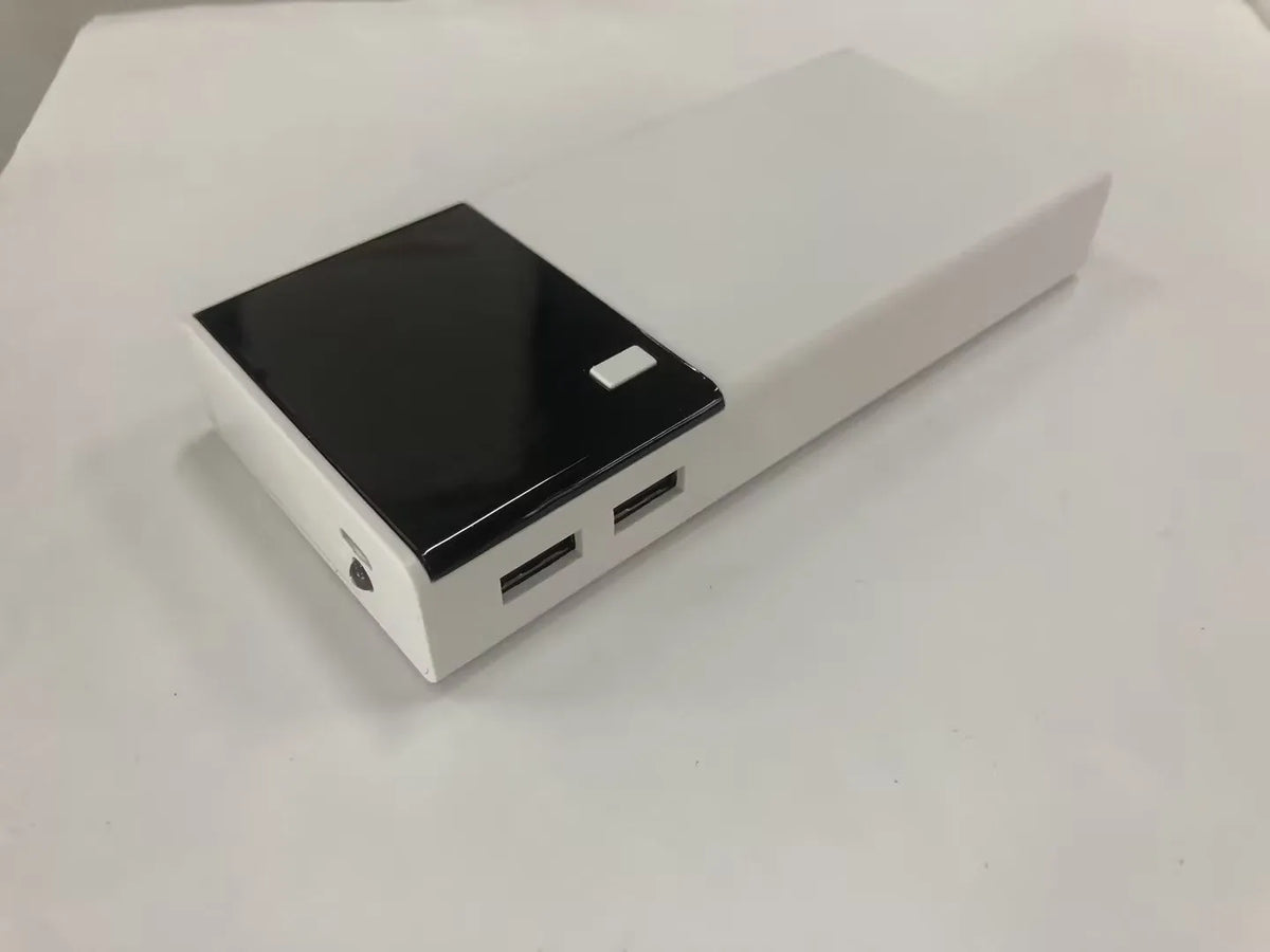 Black 20000mAh power bank with charging cable on a white background