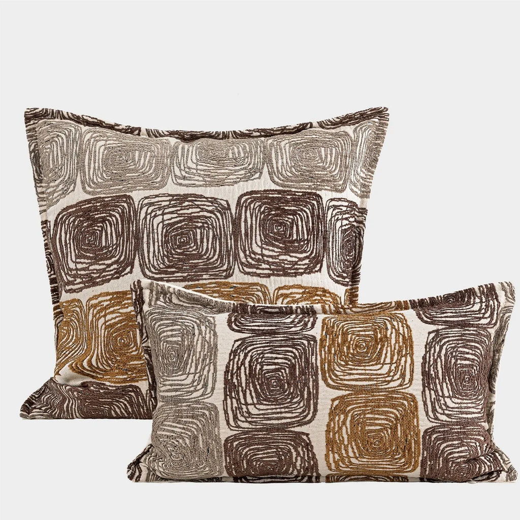 Cream and coffee coloured abstract coil pattern square pillow cover made from polyester feather velvet.