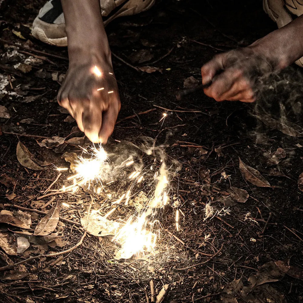 Portable outdoor flint camping sparkstone in cylindrical shape on natural background