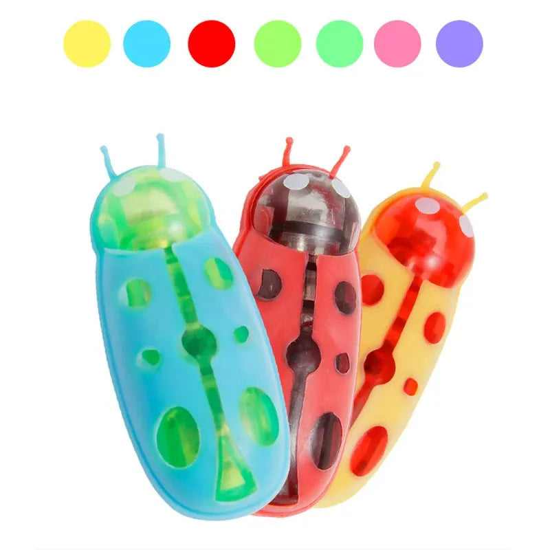 Mini electric ladybird beetle cat toy crawling on floor with red and black shell.