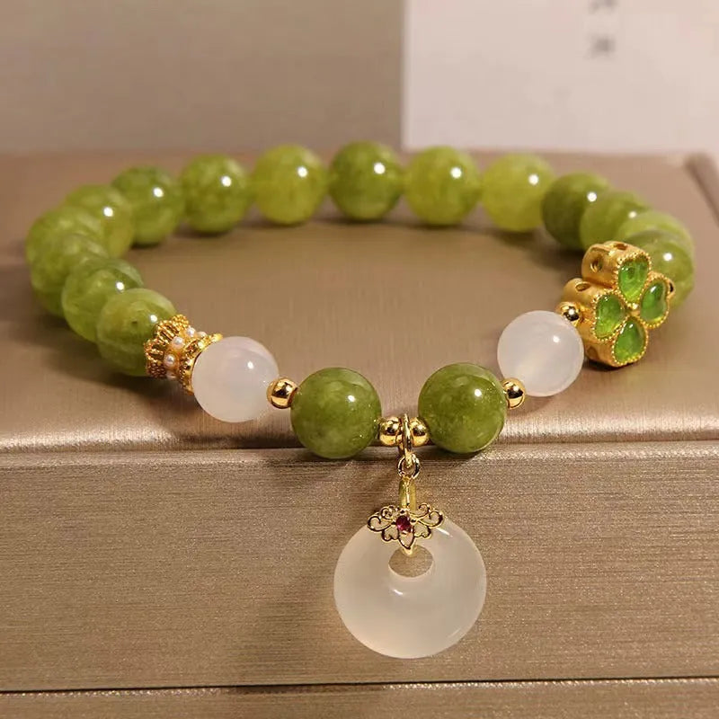 Green tourmaline four leaf clover women's bracelet with safety buckle, peace buckle, and lucky bag charm in New Chinese style.